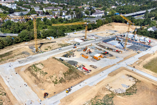 istock Large construction site, cranes and equipment - aerial view 1414014286