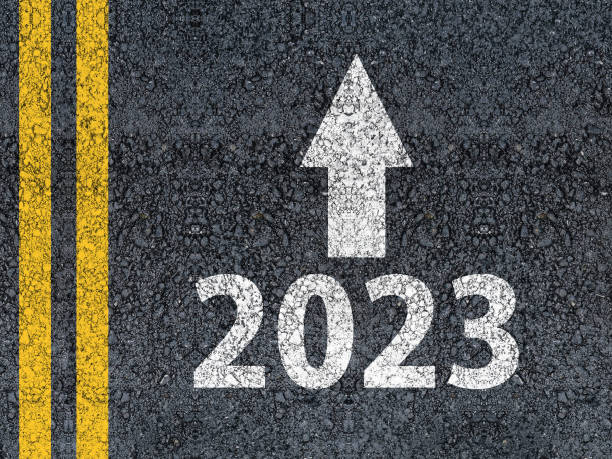 istock 2023 and an arrow written on an asphalt road 1414015091