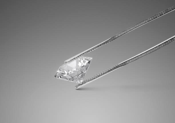istock Shiny brilliant diamond placed on gray background in diamond tweezers. 3d render 1414016847