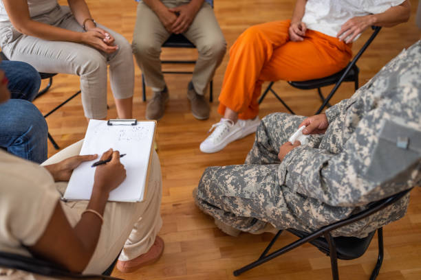 istock Unrecognizable people at the support group psychotherapy 1414017199