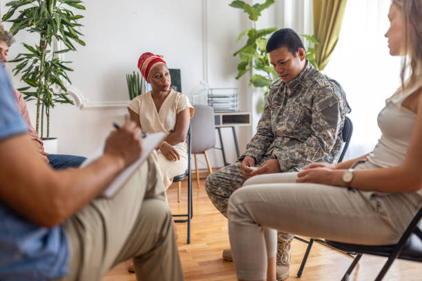 istock Soldier Japanese ethnicity crying during group support therapy 1414017520
