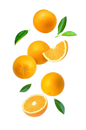 Stock photo showing heap of citrus fruit slices on white background, modern minimalist photo of circular sliced oranges, lemon and lime citrus fruits showing segments, seeds / pips and rind around edge, healthy eating concept photo for vitamin C and fruit juice.