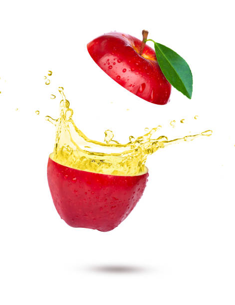 istock Red apple with apple cider vinegar or juice splash 1414019185