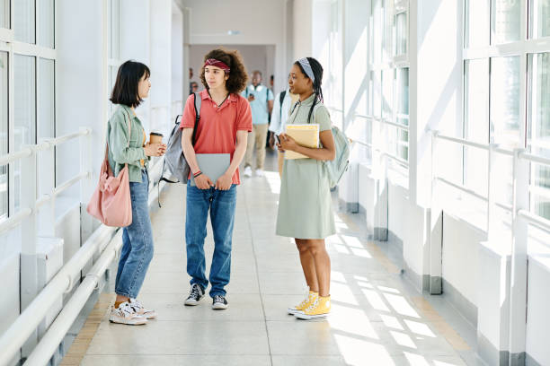 istock Friends talking after lesson at school 1414023749