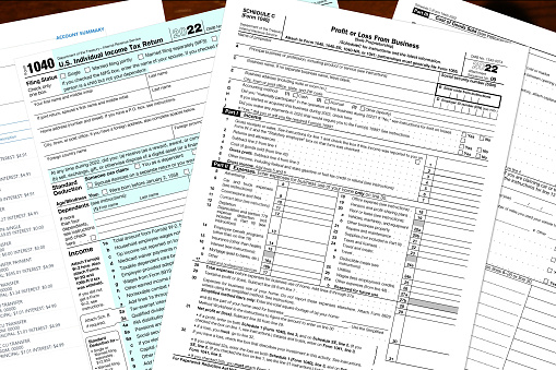 2022 IRS tax forms on a desktop.