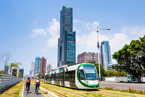 Kaohsiung, Taiwan- April 3, 2017: View of circular light rail train and the metropolitan building in Kaohsiung, Taiwan.