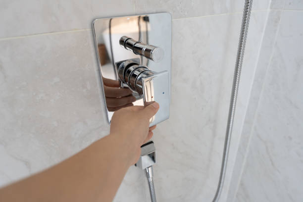 istock Hands are turning on the bathroom switch 1414028089