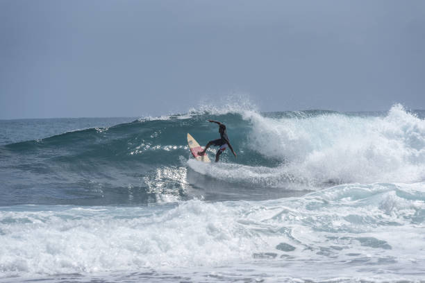 Surfer on the beach in Puerto Viejo, Limon, Costa Rica stock photo