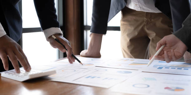 istock Business team analyzing income charts and graphs with modern laptop computer. Close up.Business analysis and strategy concept. 1414033799