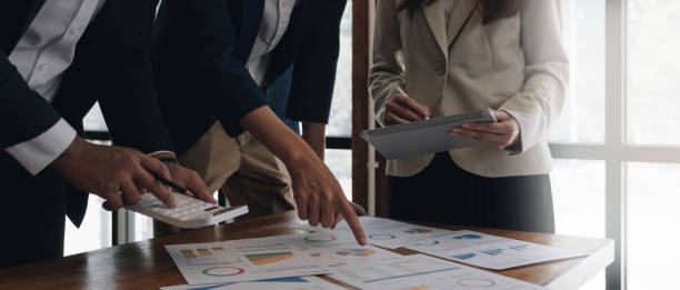 istock Business team analyzing income charts and graphs with modern laptop computer. Close up.Business analysis and strategy concept. 1414034452