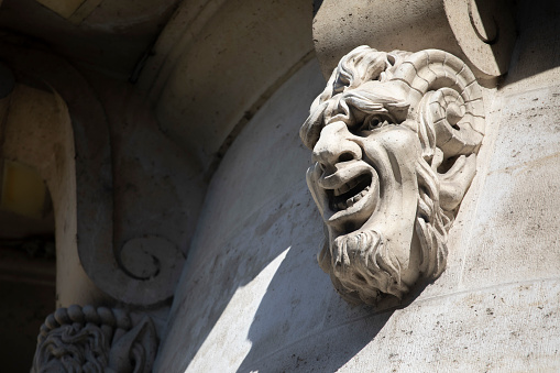 One of many mascarons which decorate the sides of Pont Neuf, Paris
