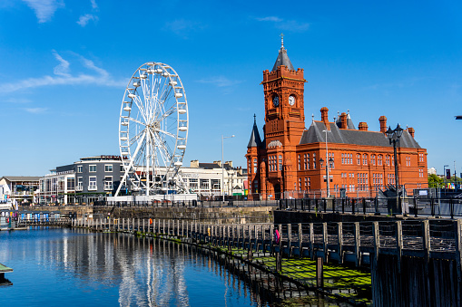 Cardiff United Kingdom Historical Red Brick Pierhead Building with Ferris Wheel in the background