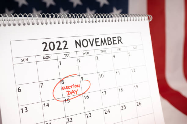 Election day concept. Desk calendar with November 8 2022 marked in red and USA flag at background stock photo