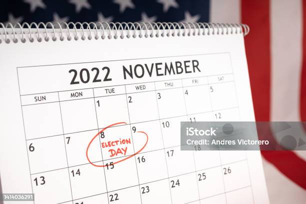 Election Day Concept Desk Calendar With November 8 2022 Marked In Red And Usa Flag At Background Stock Photo - Download Image Now