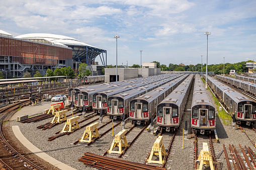 MTA Corona Maintenance Shop, Flushing, Queens, New York, NY, USA - July 2 2022: A dozen subway trains parked in the open at the depot area