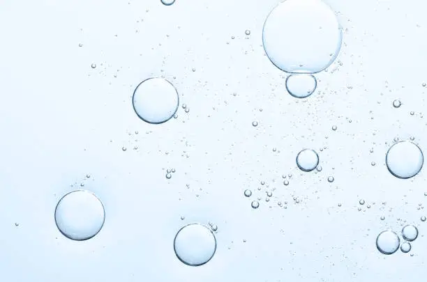 The texture of a cosmetic serum with bubbles in closeup. Macrophotography.