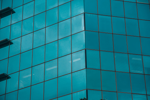 Close up shot of the glass wall of a business center building