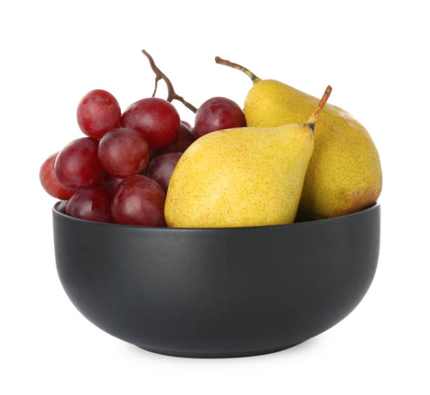 istock Fresh ripe pears and grapes in bowl on white background 1414039718