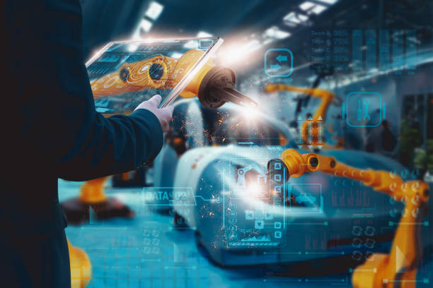エンジニア制御自動ロボットアーム工場での組み立て、スマートタブレット、自動車産業、車両生産ライン、製造、運用ビジネスおよび産業4.0、人工知能またはai - 自動溶接トーチ ストックフォトと画像
