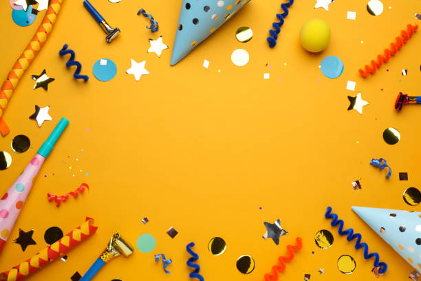 istock Frame of party items on orange background, flat lay. Space for text 1414040171
