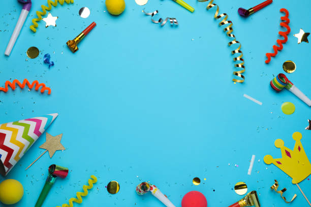 istock Frame of party items and confetti on light blue background, flat lay. Space for text 1414040353