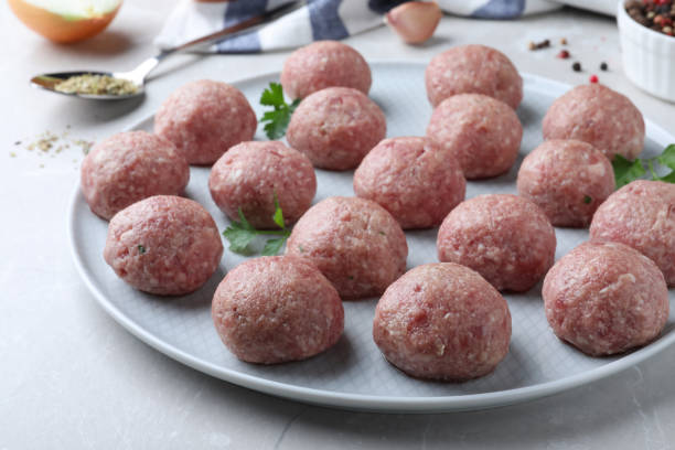 istock Many fresh raw meatballs on light table 1414040396