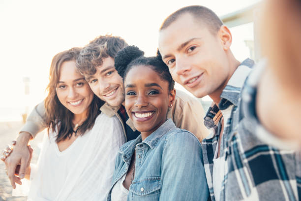 istock Friends shoot a selfie on beach in California 1414041089