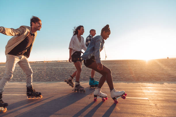 istock Friends roller skating by the beach in California 1414042384