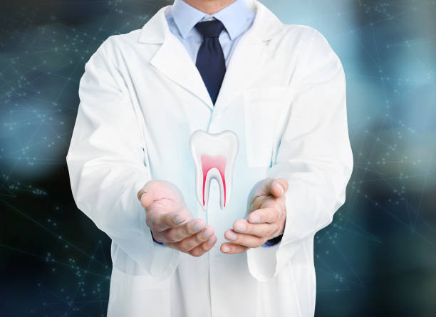 istock Dentist showing virtual model of tooth on blurred background, closeup 1414042392