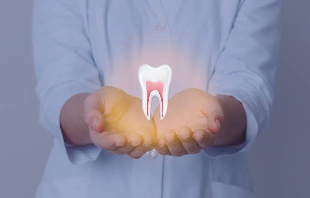 istock Dentist showing virtual model of tooth on grey background, closeup 1414042453