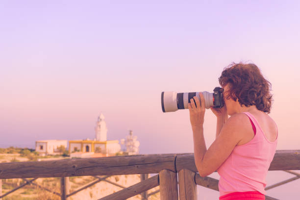 istock Tourist take photo at lighthouse, Cabo de Gata, Spain 1414042685