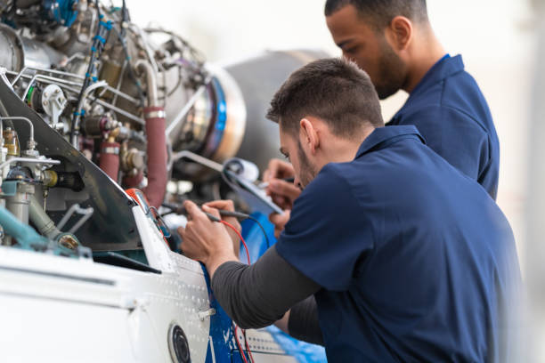 istock Aircraft Mechanics And Engineers In The Hangar 1414042769