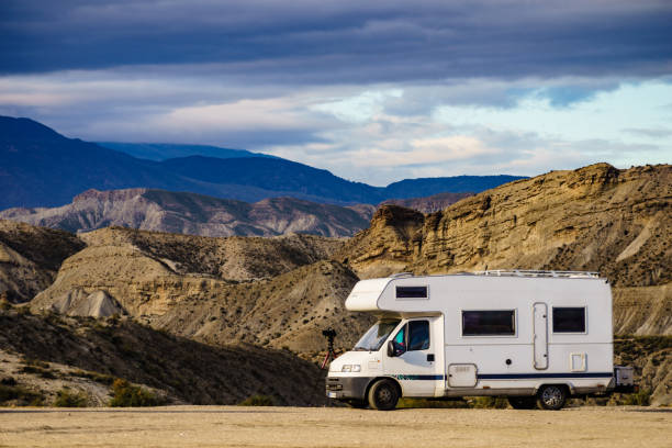 istock Camper vehiclein Tabernas desert, Spain 1414043110