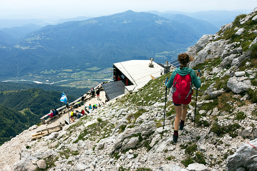 Mount Krn, Kobarid, Julian Alps, Slovenia - July 07, 2021: Hiker Descending to Mountain Hut on Mount Krn Julian Alps Slovenia
