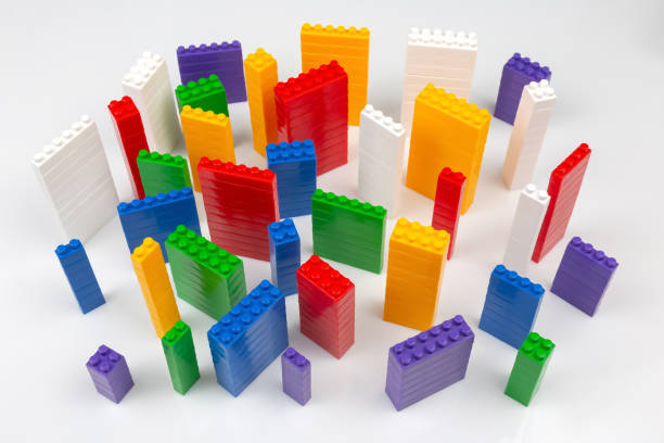 istock colored blocks of a plastic constructor on a white background in the form of multi-storey buildings. concept of modern buildings and houses 1414047071