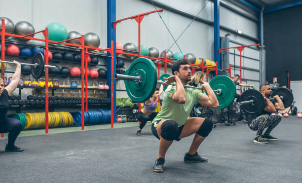 istock People practicing weightlifting in the gym 1414047639