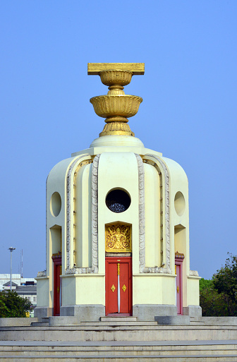 Bangkok, Thailand: Democracy Monument, architect Chitrasen Aphaiwong, 1939 - representation of a palm-leaf manuscript box holding the Thai Constitution of 1932, on top of two golden offering bowls above a round turret -  traffic circle on the wide east-west Ratchadamnoen Avenue, at the intersection of Dinso Road.