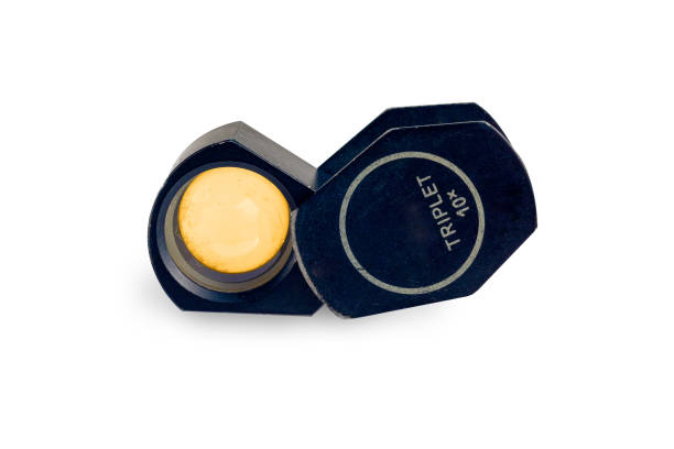 istock Magnifying glass for see the  amulet on  Background. 1414048619