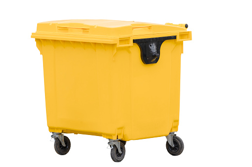 yellow plastic bin on wheels with closed lid for separate waste collection isolated on white background