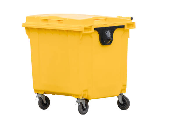 yellow plastic bin with wheels stock photo