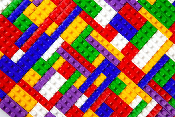 istock Abstract background texture of colored constructor blocks. Background of colorful plastic part of constructor. Pile of colored toy bricks. 1414050115