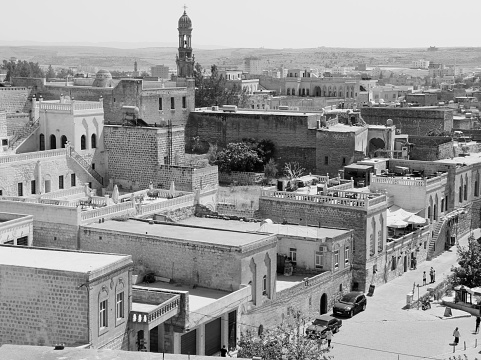 Panoramic view of Midyat city with historical houses, mosque and Assyrian church