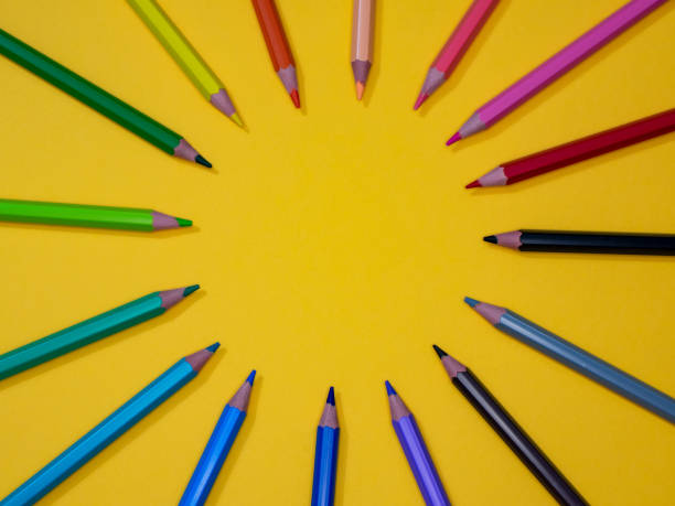 istock colored pencils on yellow background 1414051330