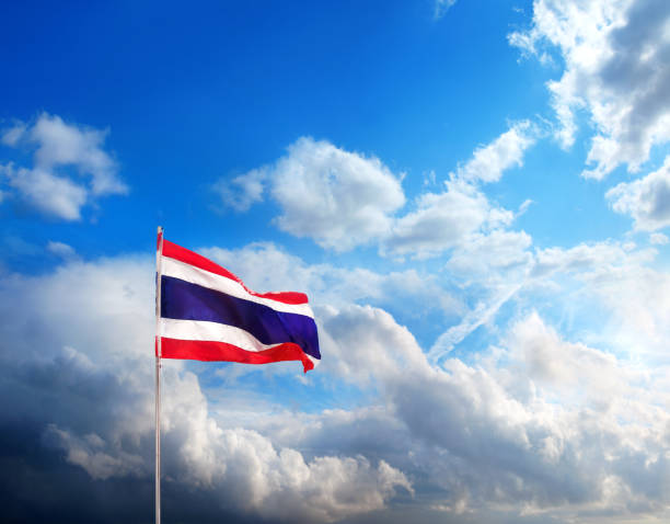 istock Close up Thai flag at flagpole over dramatic cloudy sky 1414051830