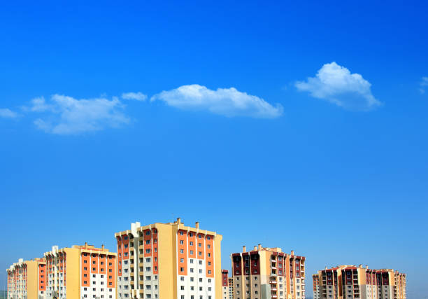Incomplete new residential apartment buildings over sky stock photo