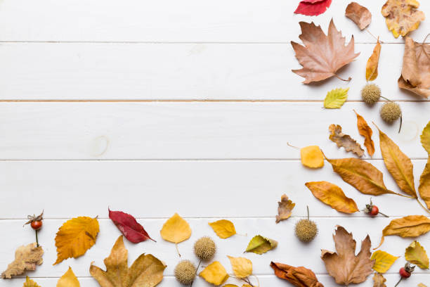 istock Autumn composition. Pattern made of dried leaves and other design accessories on table. Flat lay, top view 1414055417