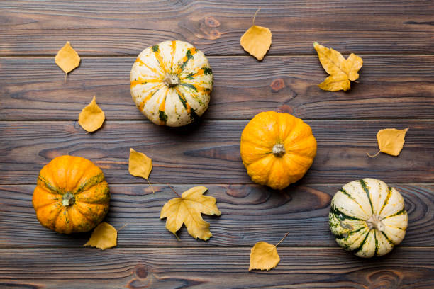 istock Autumn composition. Pattern made of dried leaves and other design accessories on table. Flat lay, top view 1414055474