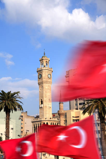 Clock tower and palm trees at city square in Izmir stock photo