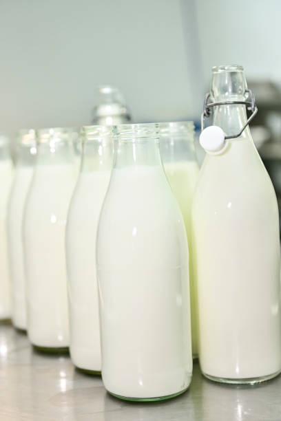 istock Glass bottles, filled with fresh goat's milk 1414057660