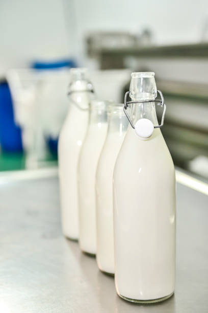 istock Glass bottles, filled with fresh goat's milk 1414057665